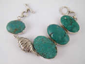 Appraisal: A white metal tests silver turquoise bracelet largest turquoise approx