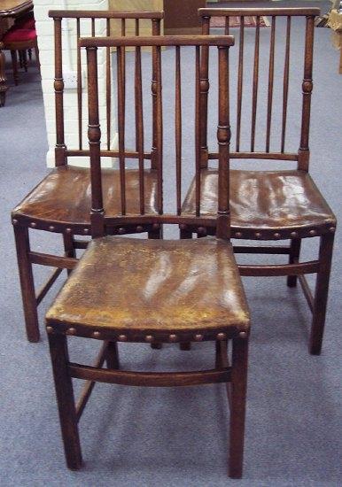 Appraisal: Eight spindle back dining chairs with bowed top rails having