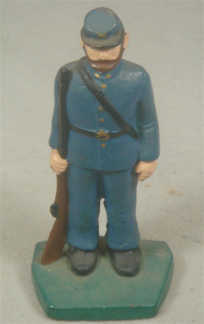 Appraisal: Cast iron doorstop Civil War infantryman in light blue uniform