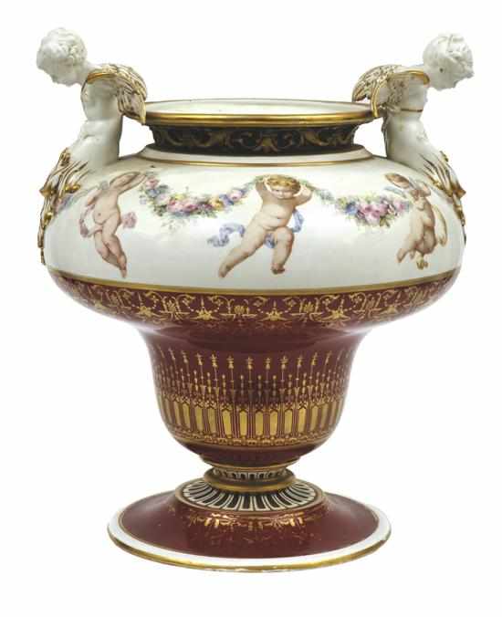 Appraisal: A CONTINENTAL PORCELAIN COMPORT WITH CHERUBS CIRCA On splay foot