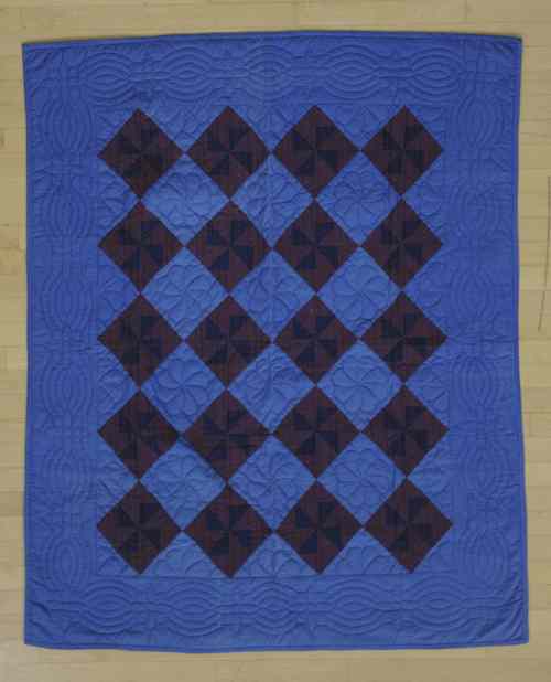 Appraisal: Amish block quilt early th c together with a pinwheel