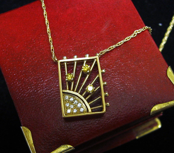 Appraisal: YELLOW DIAMOND AND FOURTEEN KARAT GOLD PENDANT NECKLACE The rectangular