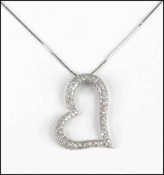 Appraisal: KARAT WHITE GOLD AND DIAMOND HEART FORM PENDANT ON BOX