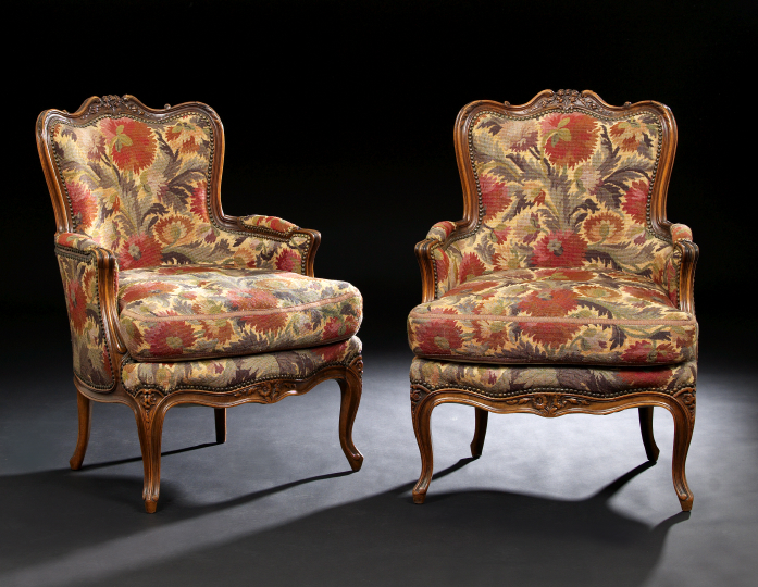 Appraisal: Pair of Provincial Louis XV-Style Fruitwood Bergeres late th century