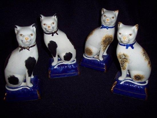 Appraisal: Two pairs of Staffordshire cats one pair ginger and white