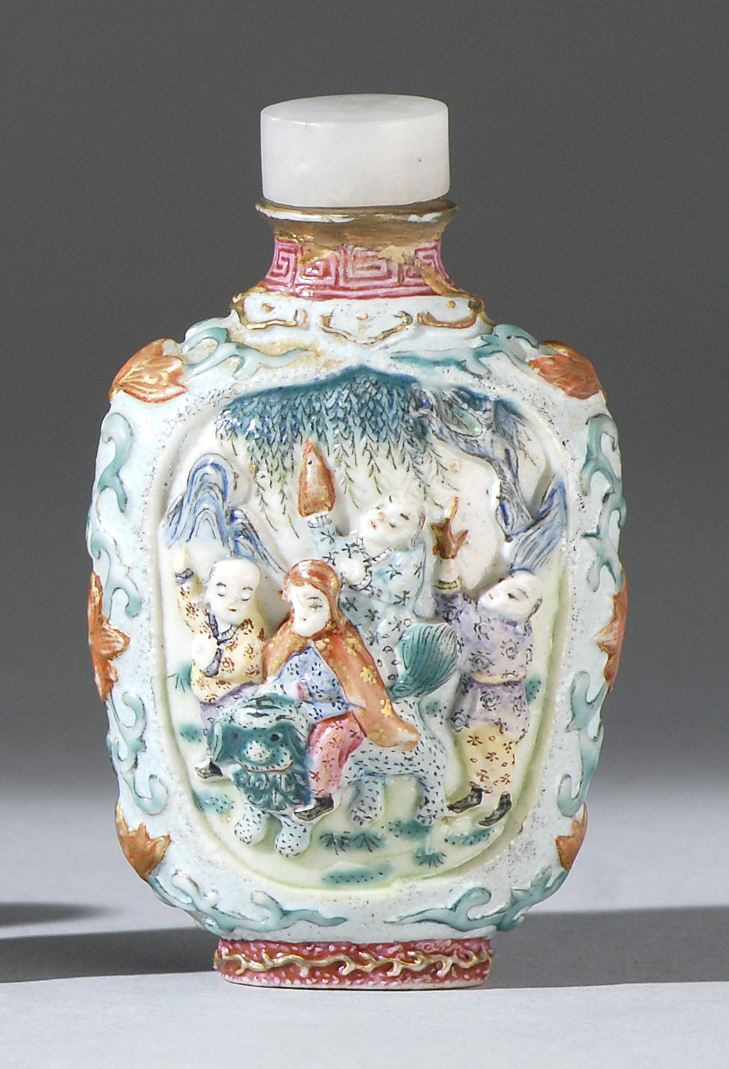 Appraisal: MOLDED PORCELAIN SNUFF BOTTLE In ovoid form with figural decoration