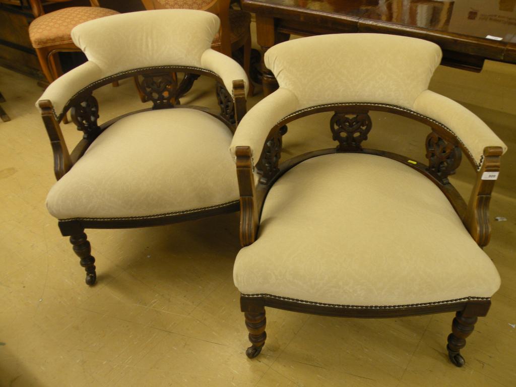 Appraisal: A pair of late Victorian tub shaped chairs each upholstered