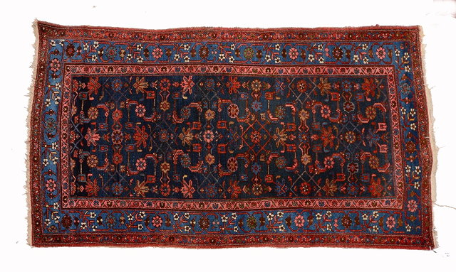 Appraisal: A HAMADAN BLUE GROUND RUG with a repeating motif of