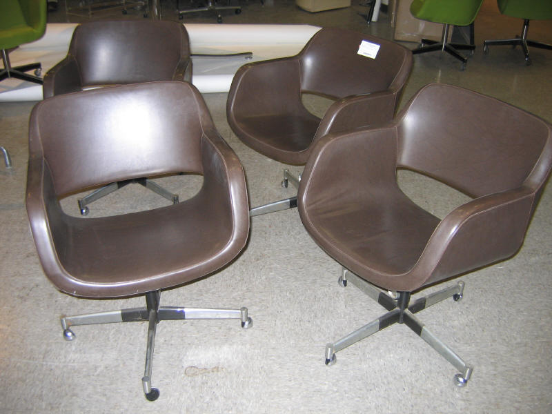 Appraisal: STENDIG FINLAND Four Paallistys brown-upholstered swivel office chairs on four-point