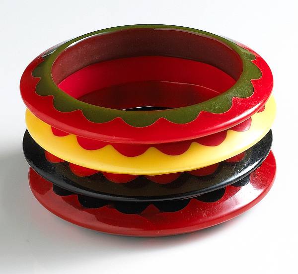 Appraisal: A collection of four bakelite laminated scalloped bracelets each of