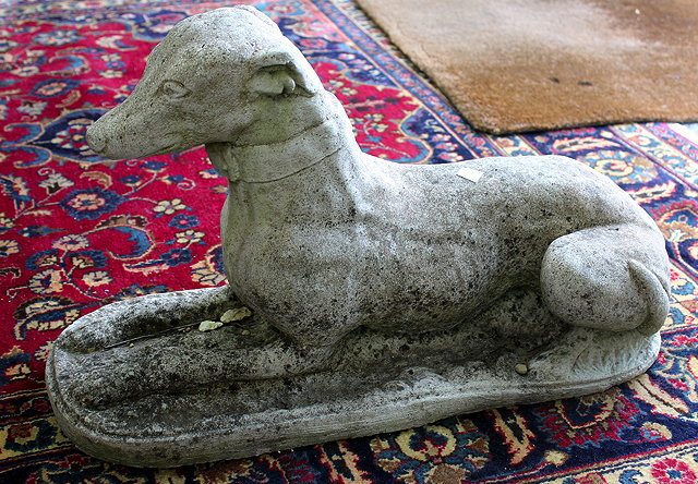 Appraisal: A COMPOSITE STONE GREYHOUND cm wide together with composite stone