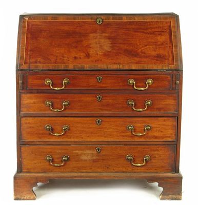 Appraisal: A George III mahogany bureau the top and fall later