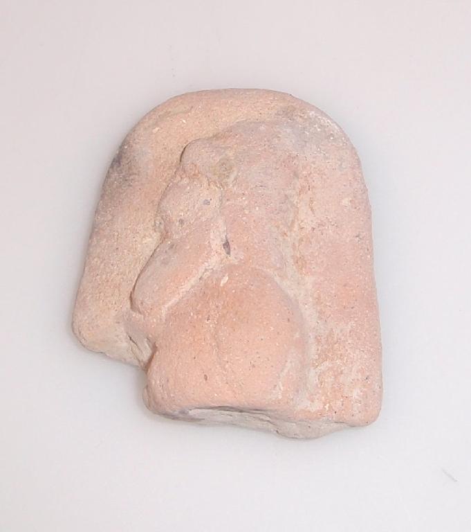 Appraisal: A fragment from the upper part of a terracotta plaque