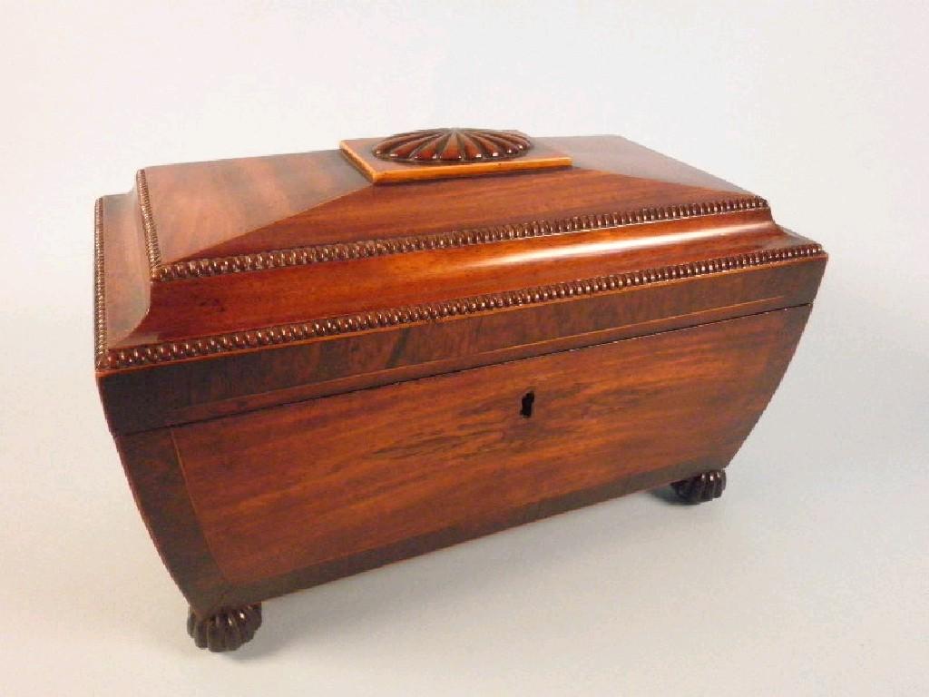 Appraisal: A George IV mahogany and rosewood cross banded sarcophagus shaped