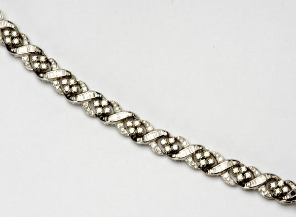 Appraisal: DIAMOND BRACELET k wg with clusters of fine circular brilliant-cut