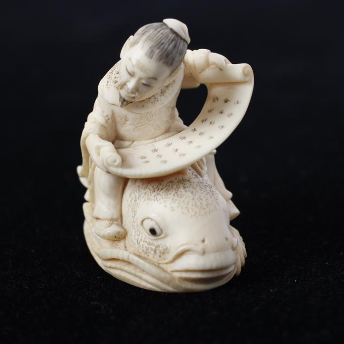 Appraisal: Japanese Carved Ivory Folklore Mechanical Netsuke Figure with scroll riding