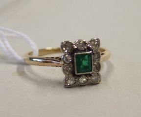 Appraisal: An emerald and diamond set cluster ring mounted with the