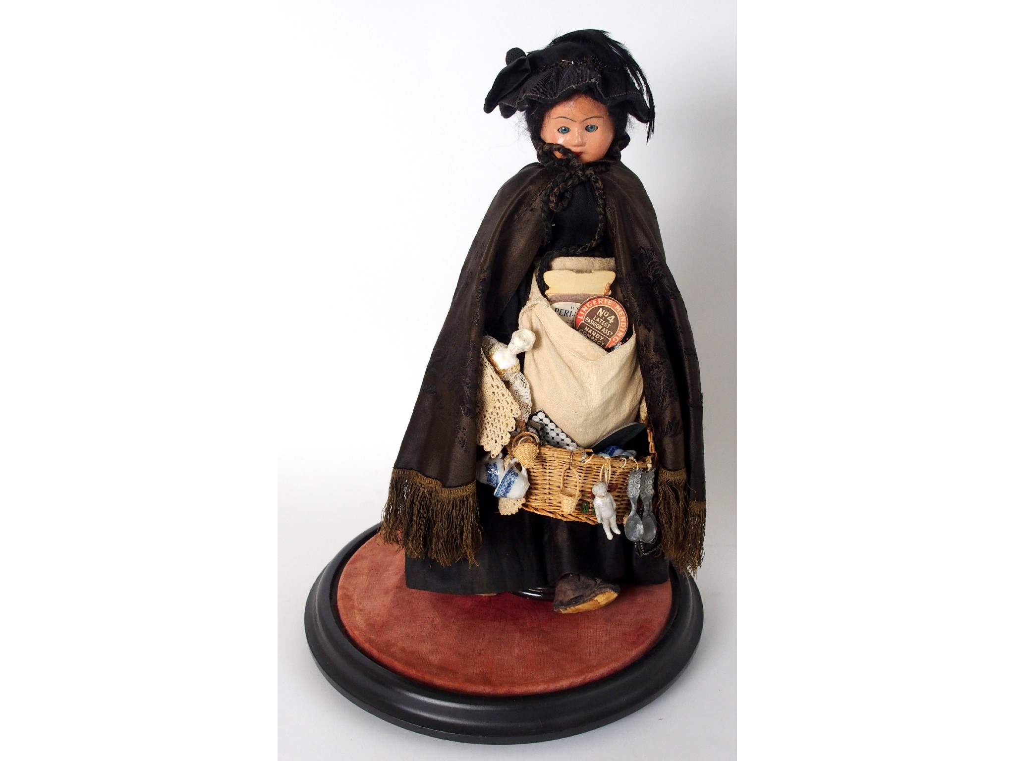 Appraisal: A Victorian peddler dollin period dress with basket and bag