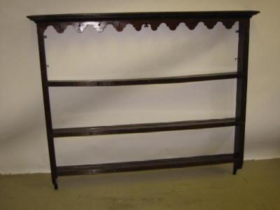 Appraisal: AN OAK DELFT RACK the dentil moulded cornice over waved