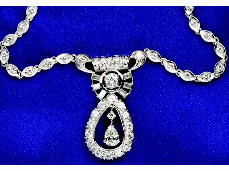 Appraisal: DIAMOND NECKLACE Platinum necklace set with one pear cut diamond