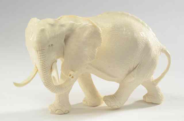 Appraisal: SOLID IVORY HAND CARVED AFRICAN ELEPHANT having long curved tusks