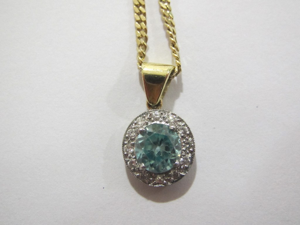 Appraisal: Eighteen carat gold mounted aquamarine and diamond cluster circular pendant