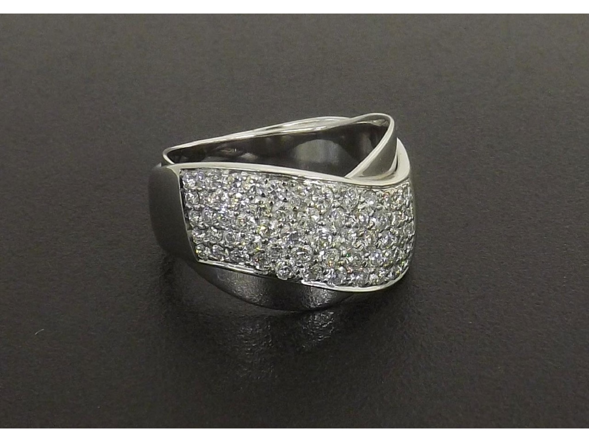 Appraisal: - -c Pav diamond set white metal ring estimated ct