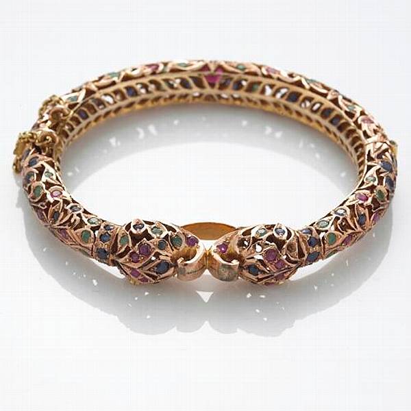 Appraisal: A ruby sapphire emerald and k gold bangle bracelet India