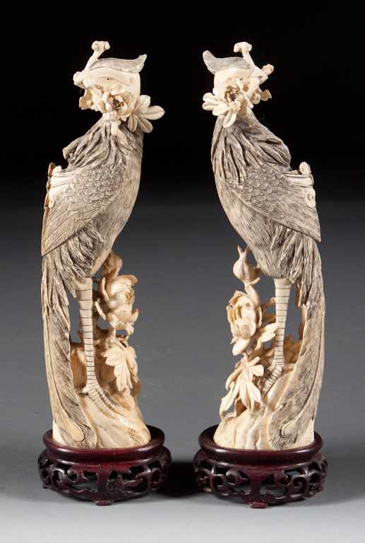 Appraisal: Pair of Chinese carved ivory phoenix figures each modeled as