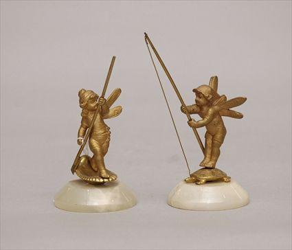 Appraisal: Two Gilt-Metal Figures of Fairies Fishing Provenance from the Estate