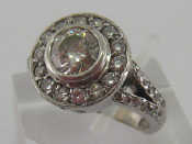 Appraisal: A diamond cluster ring the dominant central brilliant cut cts