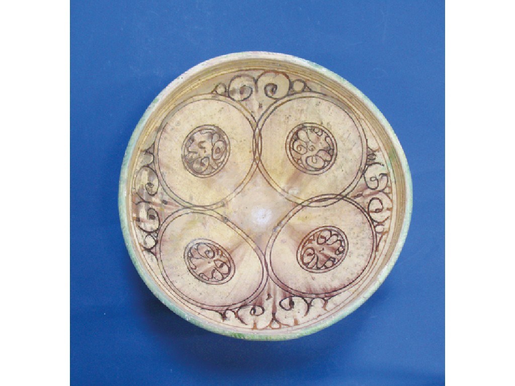 Appraisal: AN ISLAMIC POTTERY BOWL with overlapping circular decoration containing stylised