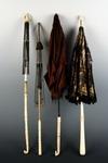 Appraisal: PARASOLS - Lot of four carved ivory and bone handle