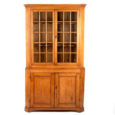 Appraisal: A pine corner cupboard with glazed upper section cm high