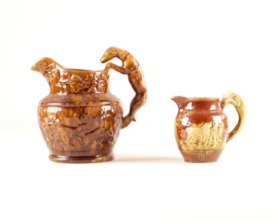 Appraisal: Two Bennington-style Pottery Pitchers the larger with a mottled brown