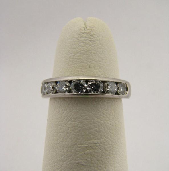 Appraisal: A Tiffany Co Platinum Diamond Band including a receipt for