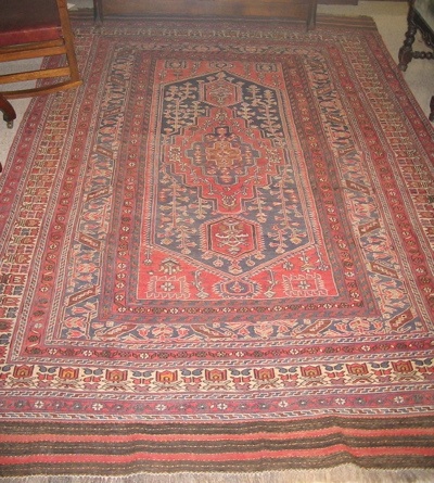 Appraisal: SOUMAK FLATWEAVE CARPET centering a set of three geometric medallions