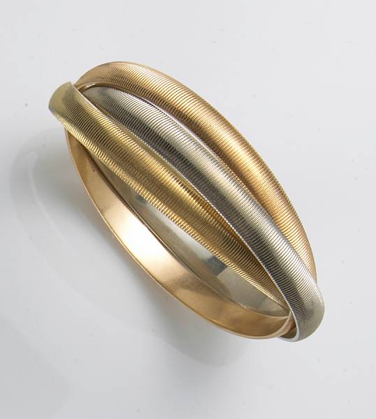 Appraisal: A k tricolor gold rolling bangle bracelet Udall amp Pallou