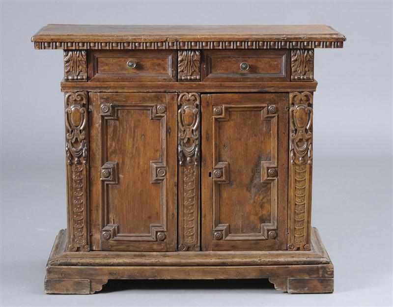 Appraisal: ITALIAN BAROQUE CARVED WALNUT SIDE CABINET With an overhanging rectangular