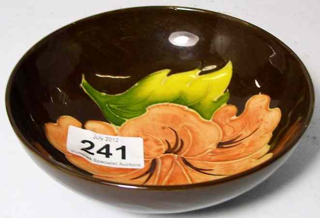 Appraisal: Moorcroft Bowl decorated in the Hibiscus design on brown diameter