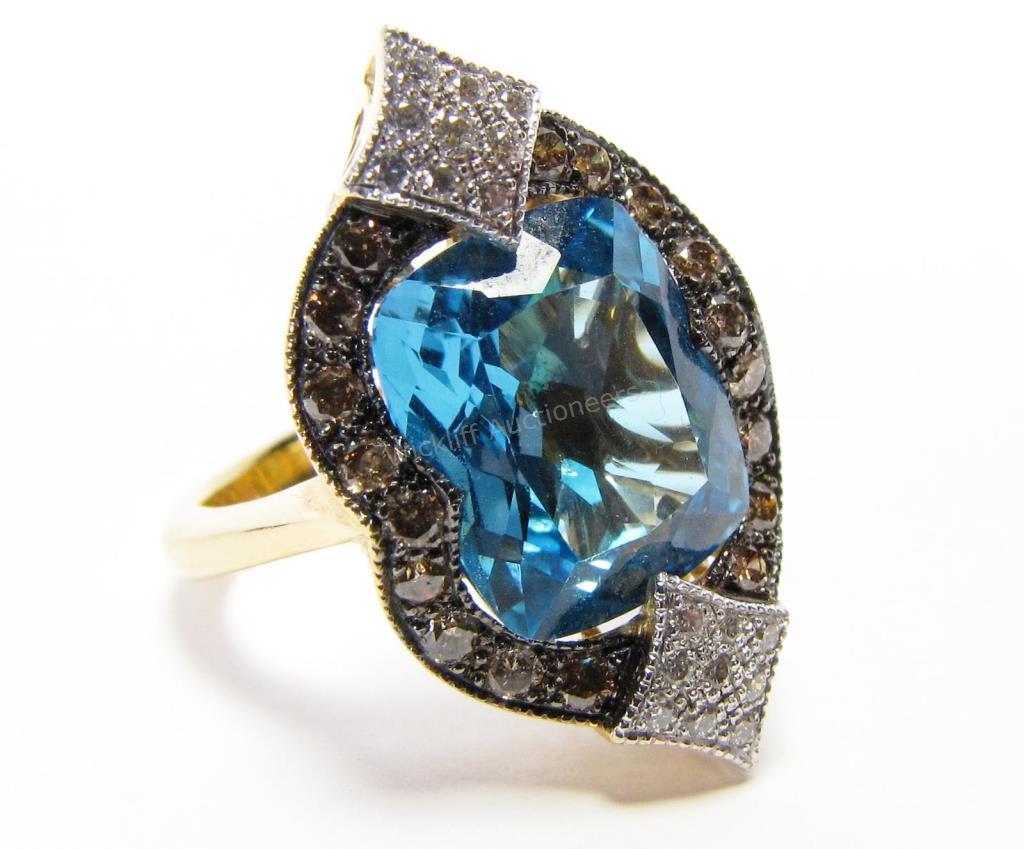 Appraisal: An K yellow gold ring with rectangular cut blue topaz