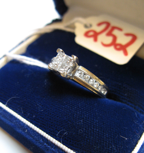 Appraisal: DIAMOND AND FOURTEEN KARAT GOLD RING centering four princess-cut diamonds