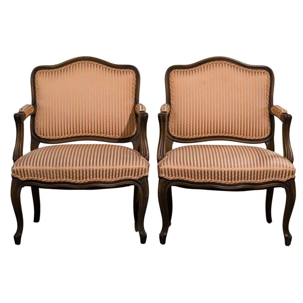 Appraisal: FRENCH PROVINCIAL STYLE UPHOLSTERED ARM CHAIRS chairs having fruitwood frames