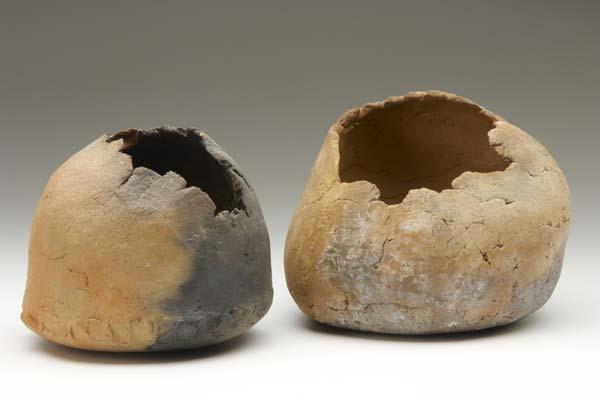 Appraisal: STUDIO POTTERY Two terra cotta vessels with torn openings Larger