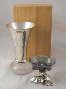 Appraisal: A modern rock crystal and silver vase the silver trumpet