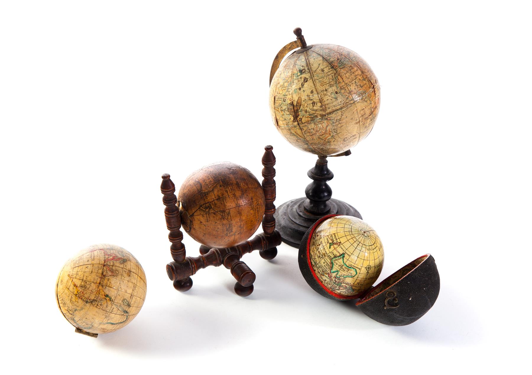 Appraisal: FOUR MINIATURE GLOBES American and European late th-early th century