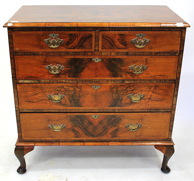 Appraisal: A GEORGIAN STYLE WALNUT CHEST of two short and three