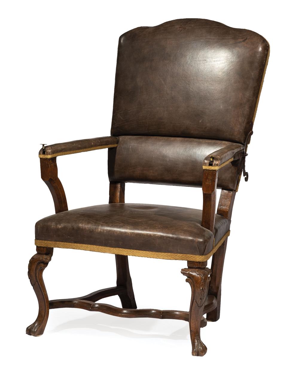 Appraisal: Italian Leather and Walnut Fauteuil a Cremaillere th c shaped