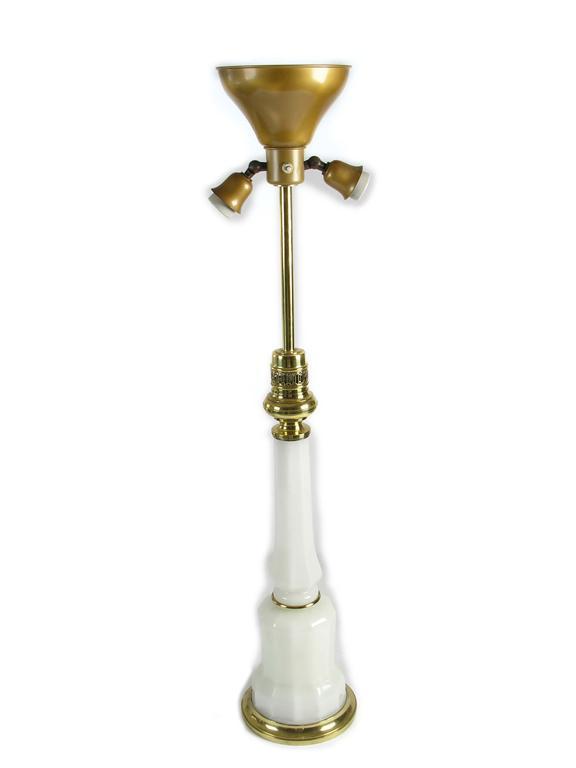 Appraisal: An opaline glass and brass mounted lamp