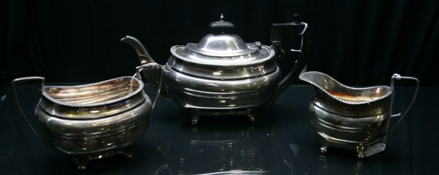 Appraisal: A Walker Hall silver plated tea set including a teapot